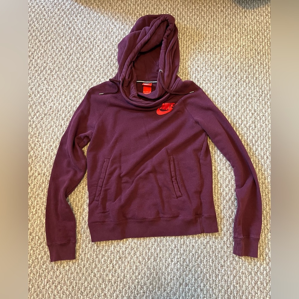 Nike women’s size medium cowl neck hoodie; maroon/magenta color. Like new.